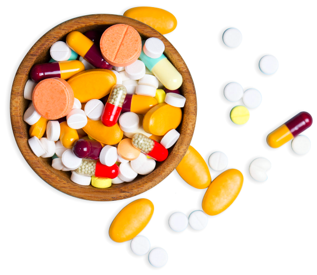 pills and tablets on a wooden bowl